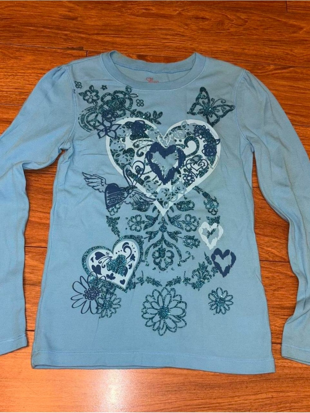 Blue long sleeve y2k top with peace sign and heart design